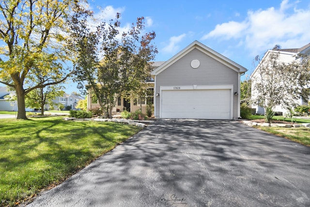 17828 S Mitchell Ln, Lockport, IL 60441 - view of front of house featuring asphalt driveway, a front lawn, and an attached garage