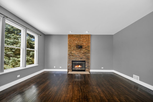 17828 S Mitchell Ln, Lockport, IL 60441 - unfurnished living room featuring dark wood-style flooring, a fireplace, and baseboards
