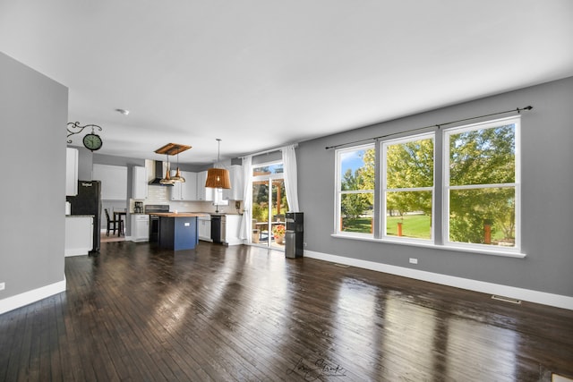 living room featuring sink and dark hardwood / wood-style flooring