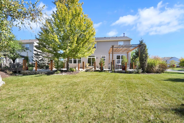 back of property featuring a yard and a pergola