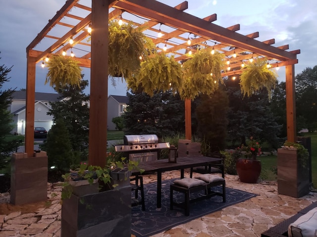 view of patio / terrace featuring a pergola and an outdoor kitchen