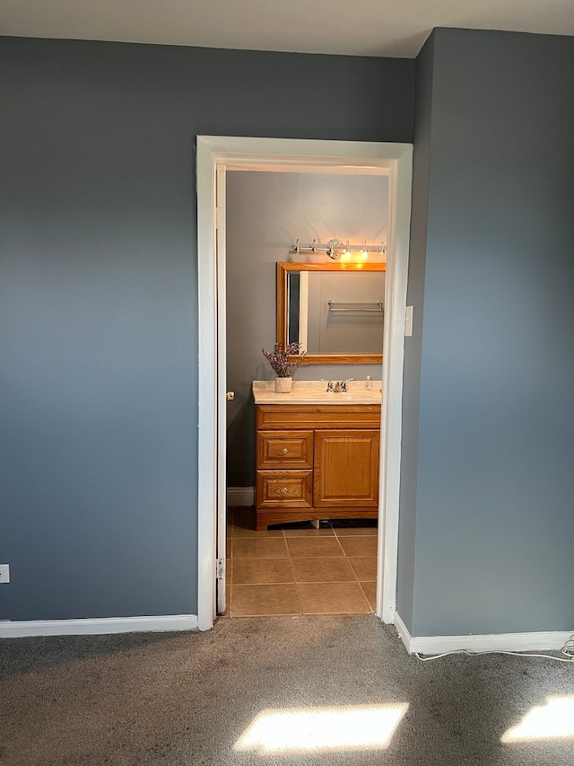 bathroom with tile patterned flooring and vanity