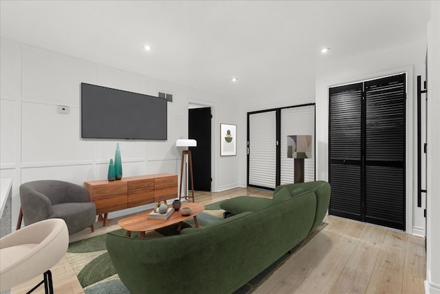 living room with light hardwood / wood-style floors