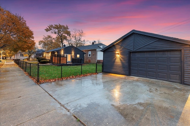 exterior space featuring an outdoor structure, a garage, and a yard