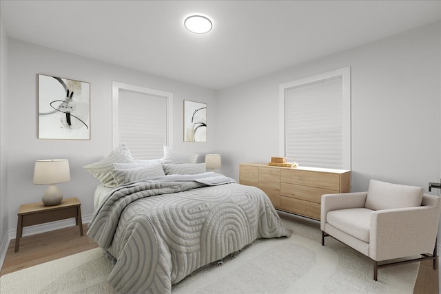 bedroom with light hardwood / wood-style floors