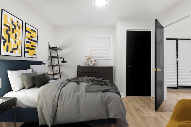 bedroom with light hardwood / wood-style flooring