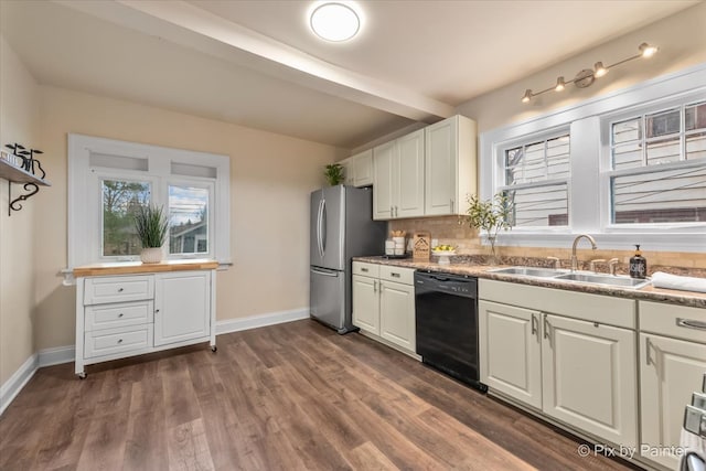 kitchen with dark wood-type flooring, white cabinets, sink, black dishwasher, and stainless steel refrigerator