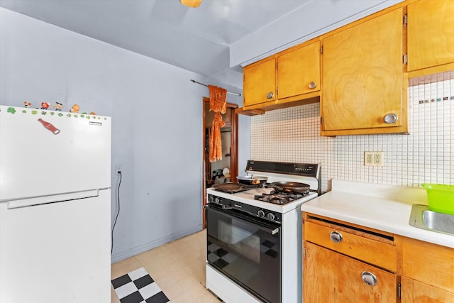 kitchen featuring tasteful backsplash and white appliances