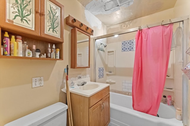 full bathroom featuring vanity, shower / bath combination with curtain, and toilet