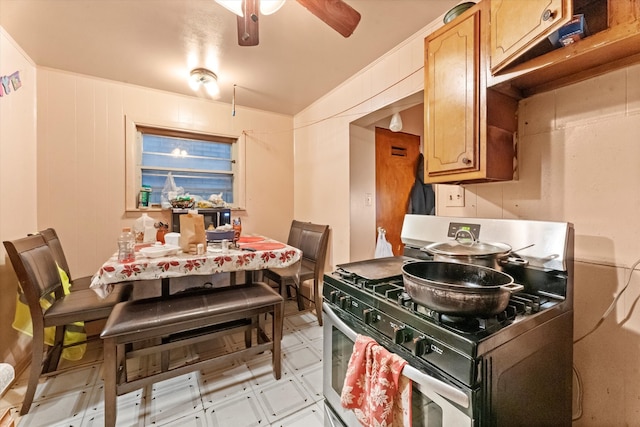 kitchen featuring gas stove and ceiling fan