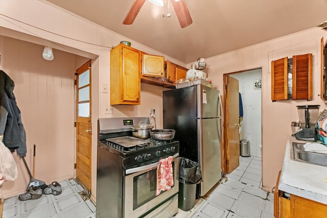 kitchen featuring ornamental molding, sink, ceiling fan, and stainless steel appliances