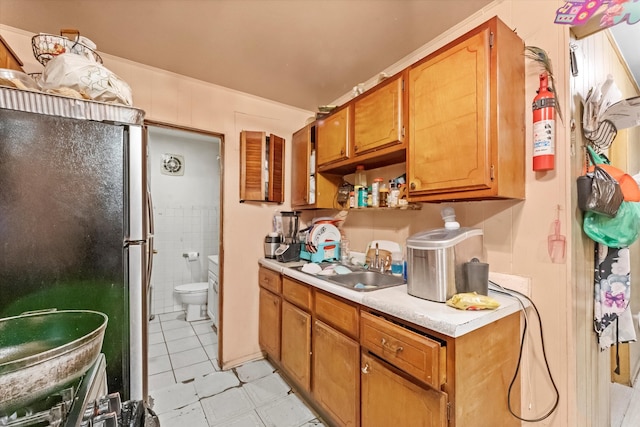 kitchen with black fridge and sink