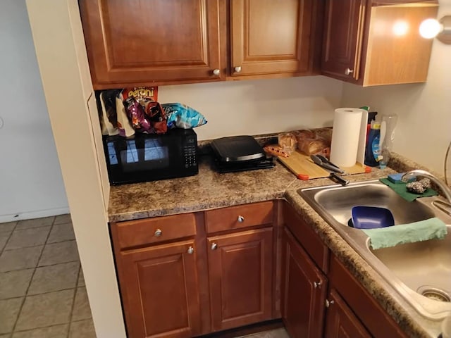 kitchen featuring sink and tile patterned floors