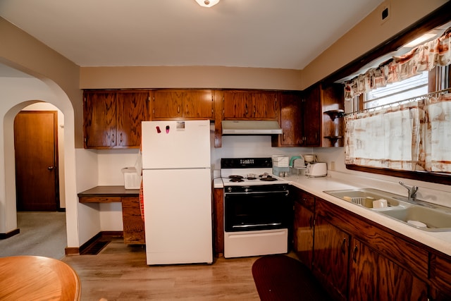 kitchen featuring light hardwood / wood-style floors, white appliances, and sink