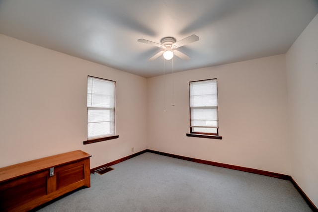 carpeted empty room with ceiling fan