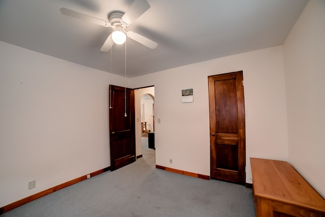 unfurnished bedroom featuring carpet flooring and ceiling fan