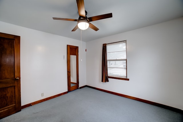 unfurnished room featuring ceiling fan and light carpet