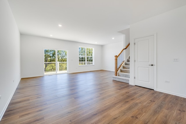 spare room featuring wood-type flooring