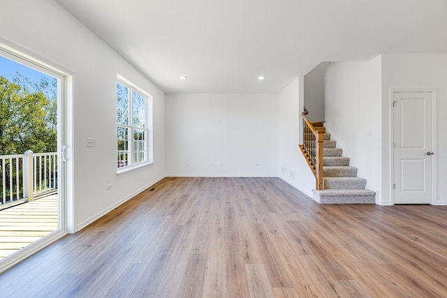 unfurnished living room with light hardwood / wood-style floors