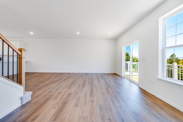 unfurnished living room featuring light hardwood / wood-style floors