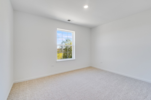 unfurnished room featuring carpet floors