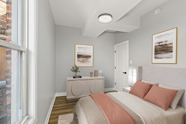 bedroom featuring dark hardwood / wood-style flooring