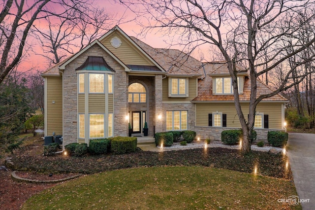 view of front of property with a yard