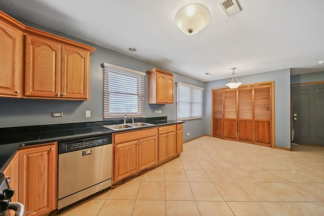 kitchen featuring dishwasher, light tile patterned flooring, hanging light fixtures, and sink