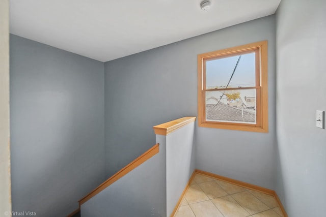 hallway with light tile patterned flooring