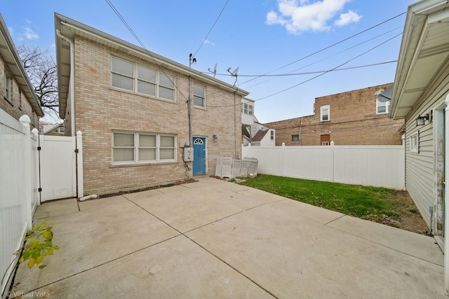 back of property featuring a patio