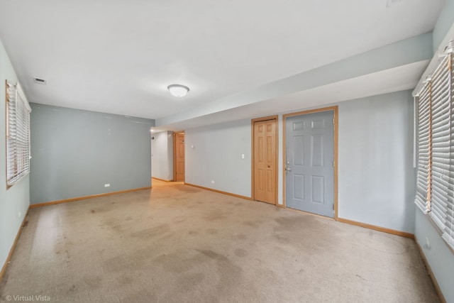 empty room with light colored carpet