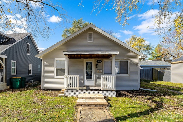 bungalow-style house featuring a front yard