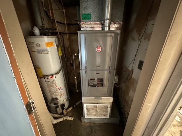 utility room featuring gas water heater