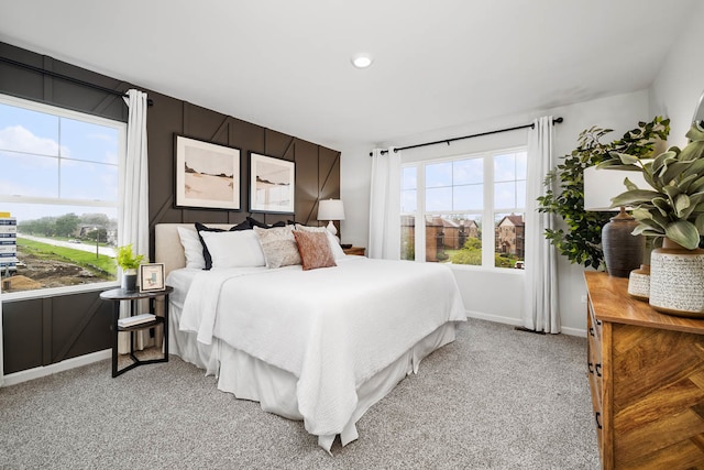 bedroom featuring light colored carpet