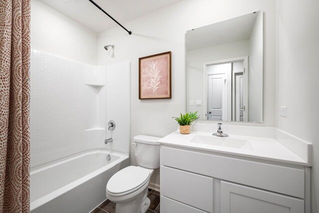 full bathroom with shower / tub combo with curtain, vanity, toilet, and tile patterned flooring