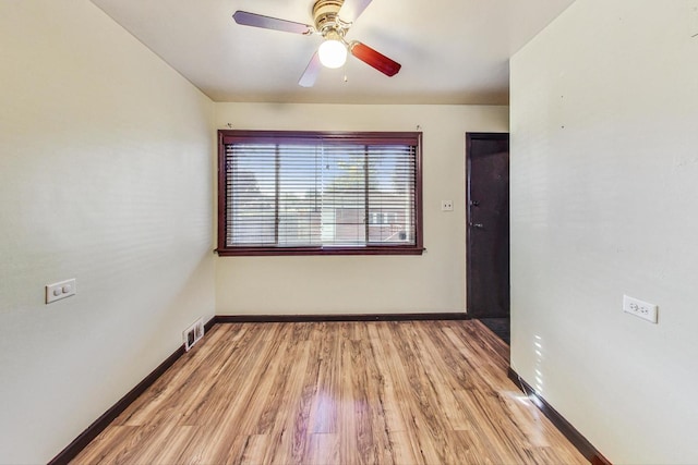 unfurnished room with ceiling fan and light hardwood / wood-style floors