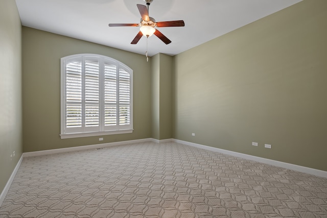 empty room with light carpet and ceiling fan