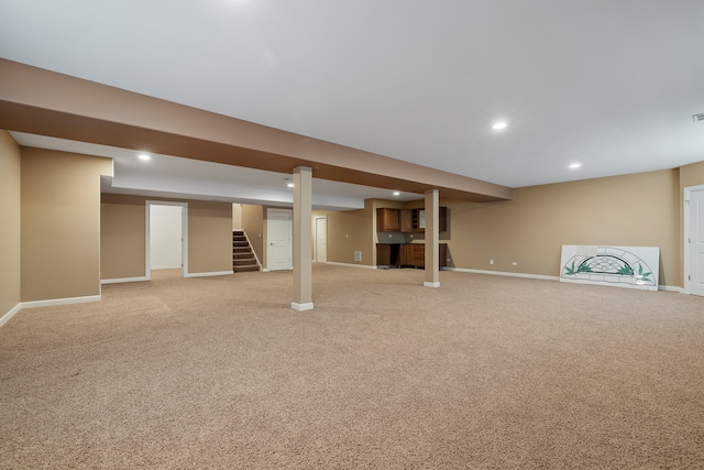 basement featuring light colored carpet