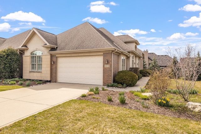 view of front of house with a front lawn and a garage