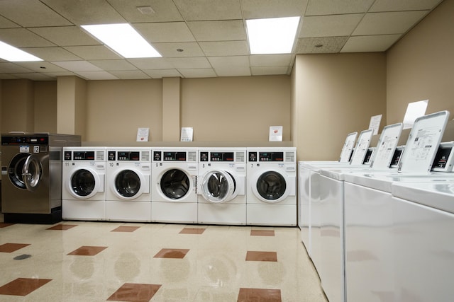 laundry area featuring light colored carpet and separate washer and dryer