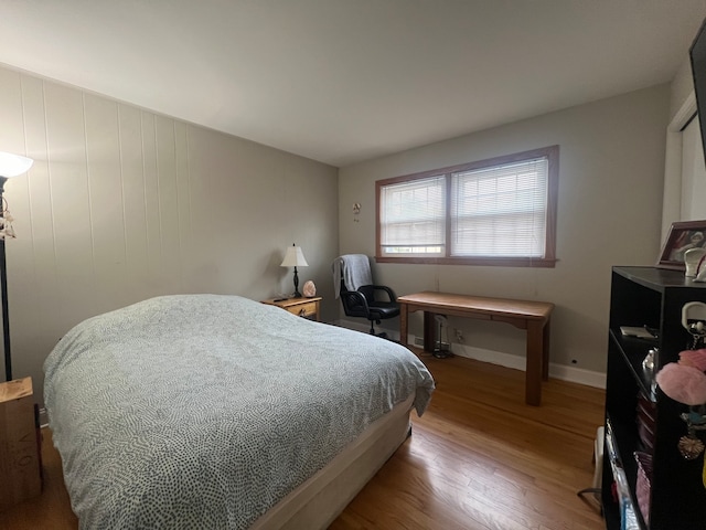 bedroom with hardwood / wood-style floors