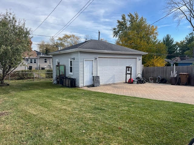 garage with a lawn