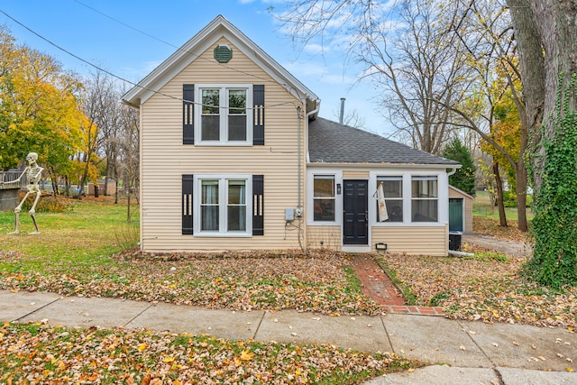 front facade with a front yard