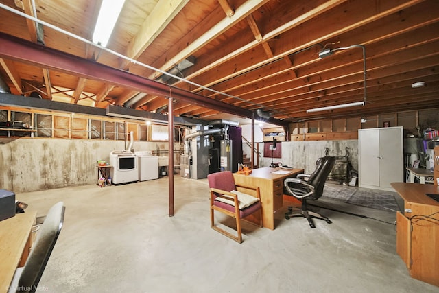 basement with washer and clothes dryer, gas water heater, and heating unit