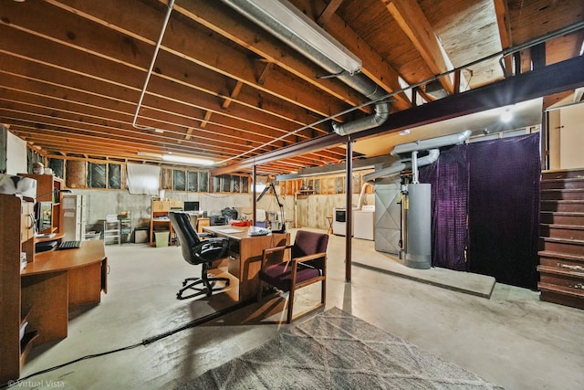 basement with washing machine and dryer and gas water heater