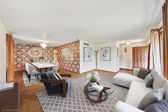 living room featuring an inviting chandelier