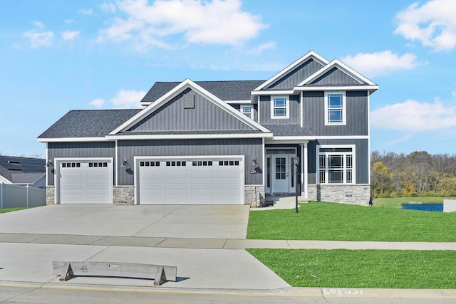 craftsman-style house with a garage and a front yard