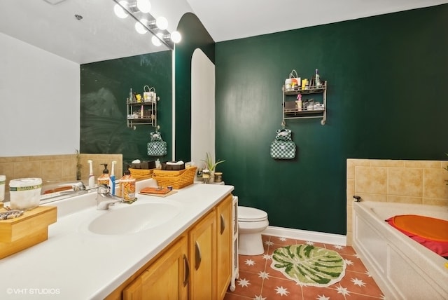 bathroom with vanity, toilet, a bathing tub, and tile patterned flooring