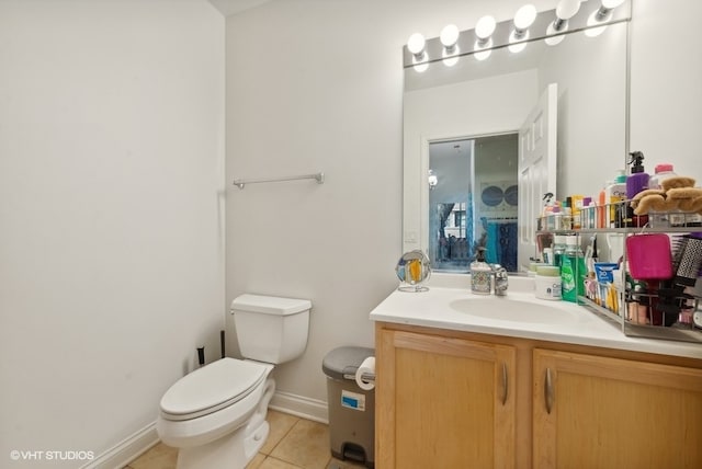 bathroom featuring toilet, vanity, and tile patterned floors