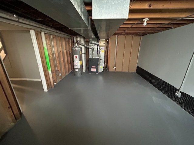 basement featuring heating unit and gas water heater